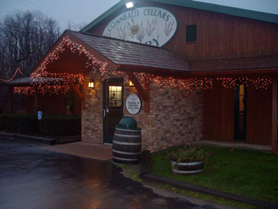 Conneaut Cellars Winery shown in the evening during extended holiday hours in December