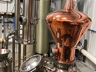 Conneaut Cellars Winery and Distillery distilling equipment room.