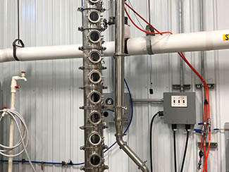 Sensitive gauges and valves assist in the distilling process.