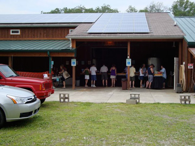 Customers touring the winery production area and sample tasting Conneaut Cellars wines