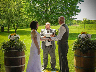 Wedding ceremony being conducted at Conneaut Cellars beautiful picnic pavilion